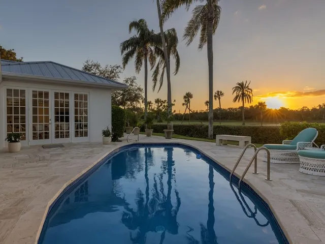 a view of a swimming pool with a lounge chair