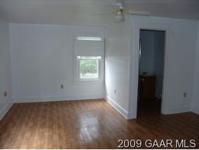 30 Fishersville Road Fishersville, VA 22939 - Photo 5 of 8 an empty room with wooden floor and a window