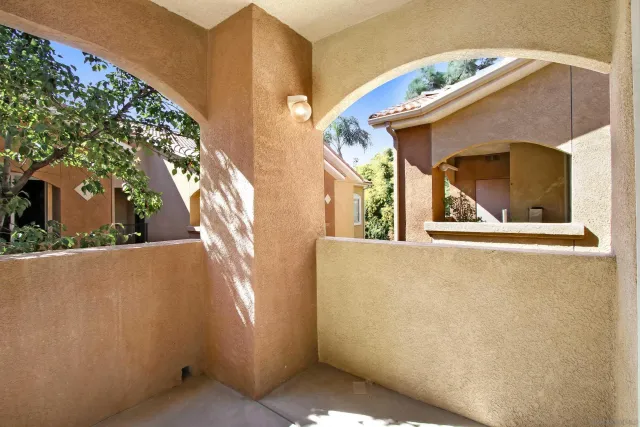 a view of balcony with a small yard