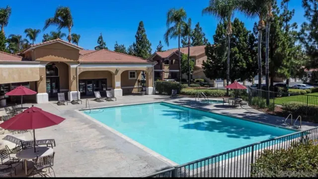 a view of a patio with swimming pool table and chairs
