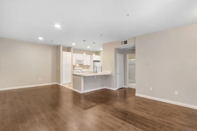 a view of kitchen with wooden floor