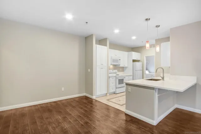 a view of kitchen with wooden floor