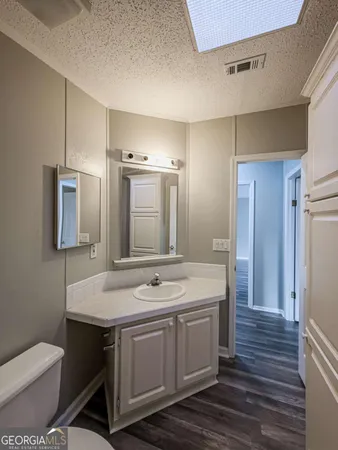 a view of a room with wooden floor and stairs
