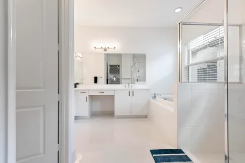 a bathroom with a shower and a sink