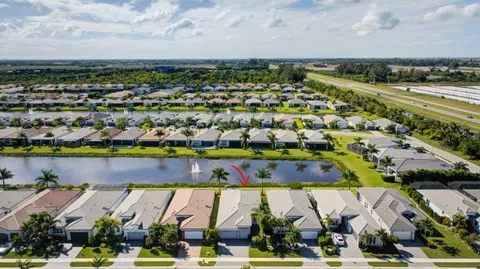 an aerial view of residential building with swimming pool