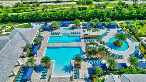 a large room with wooden floor and furniture