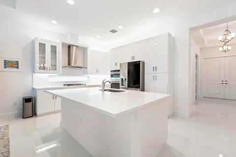 a kitchen with a sink a stove and refrigerator