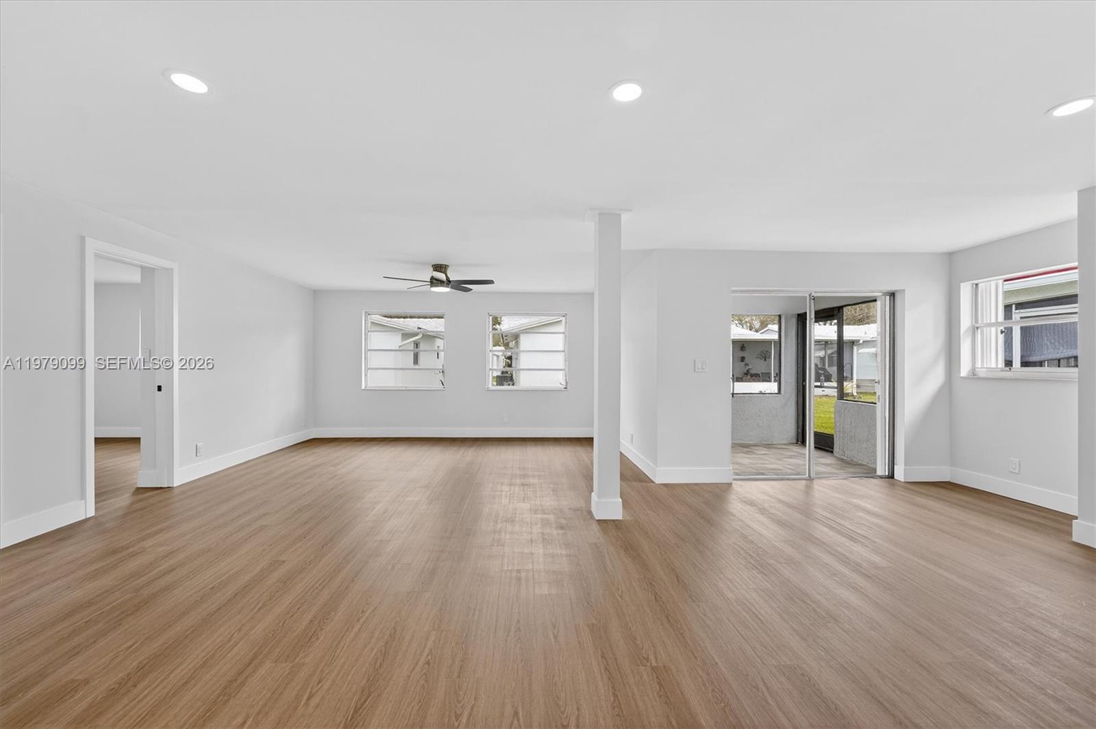 8941 Northwest 13th Street Plantation, FL 33322 - Photo 12 of 26 an empty room with wooden floor and windows