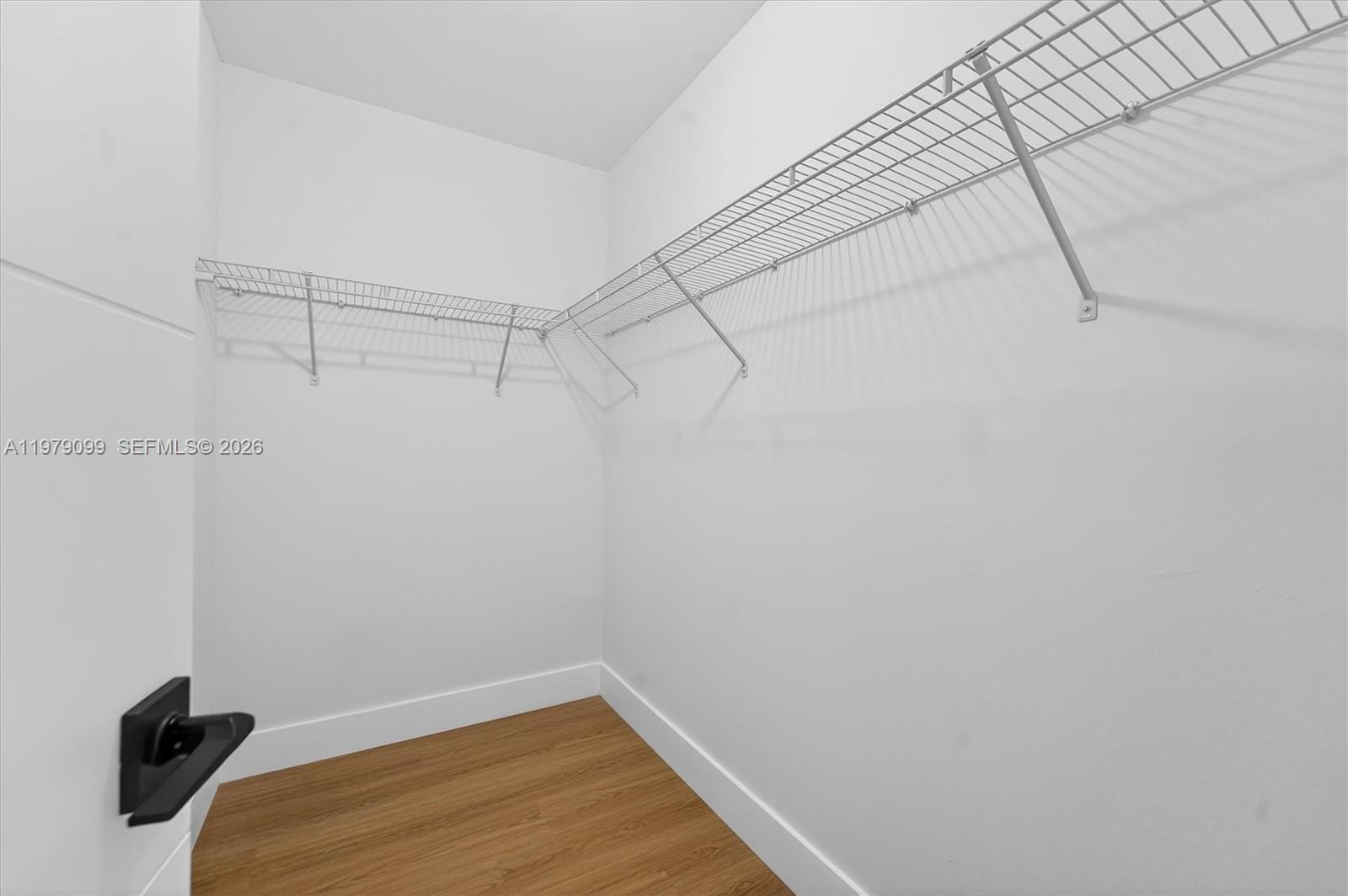 8941 Northwest 13th Street Plantation, FL 33322 - Photo 16 of 26 a view of a room with racks on the wall