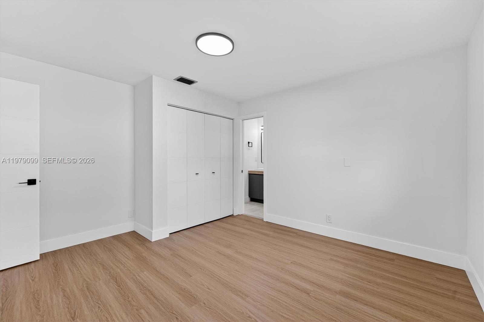 8941 Northwest 13th Street Plantation, FL 33322 - Photo 20 of 26 a view of an empty room with wooden floor