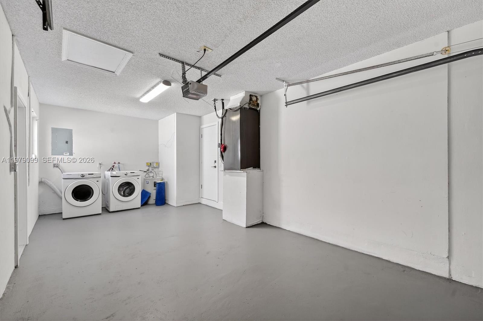 8941 Northwest 13th Street Plantation, FL 33322 - Photo 22 of 26 a view of a utility room with washer and dryer