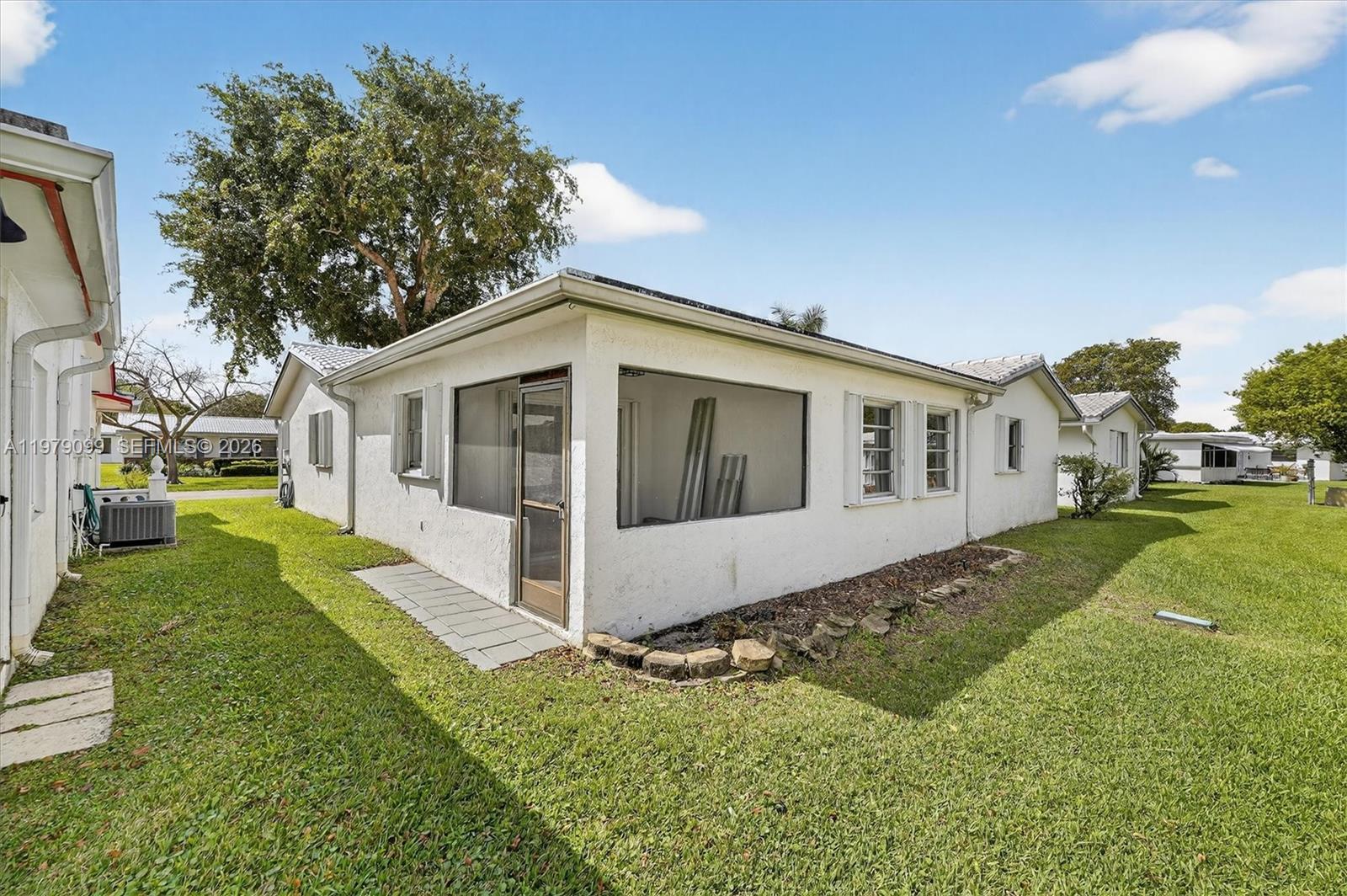 8941 Northwest 13th Street Plantation, FL 33322 - Photo 24 of 26 a view of house with a yard