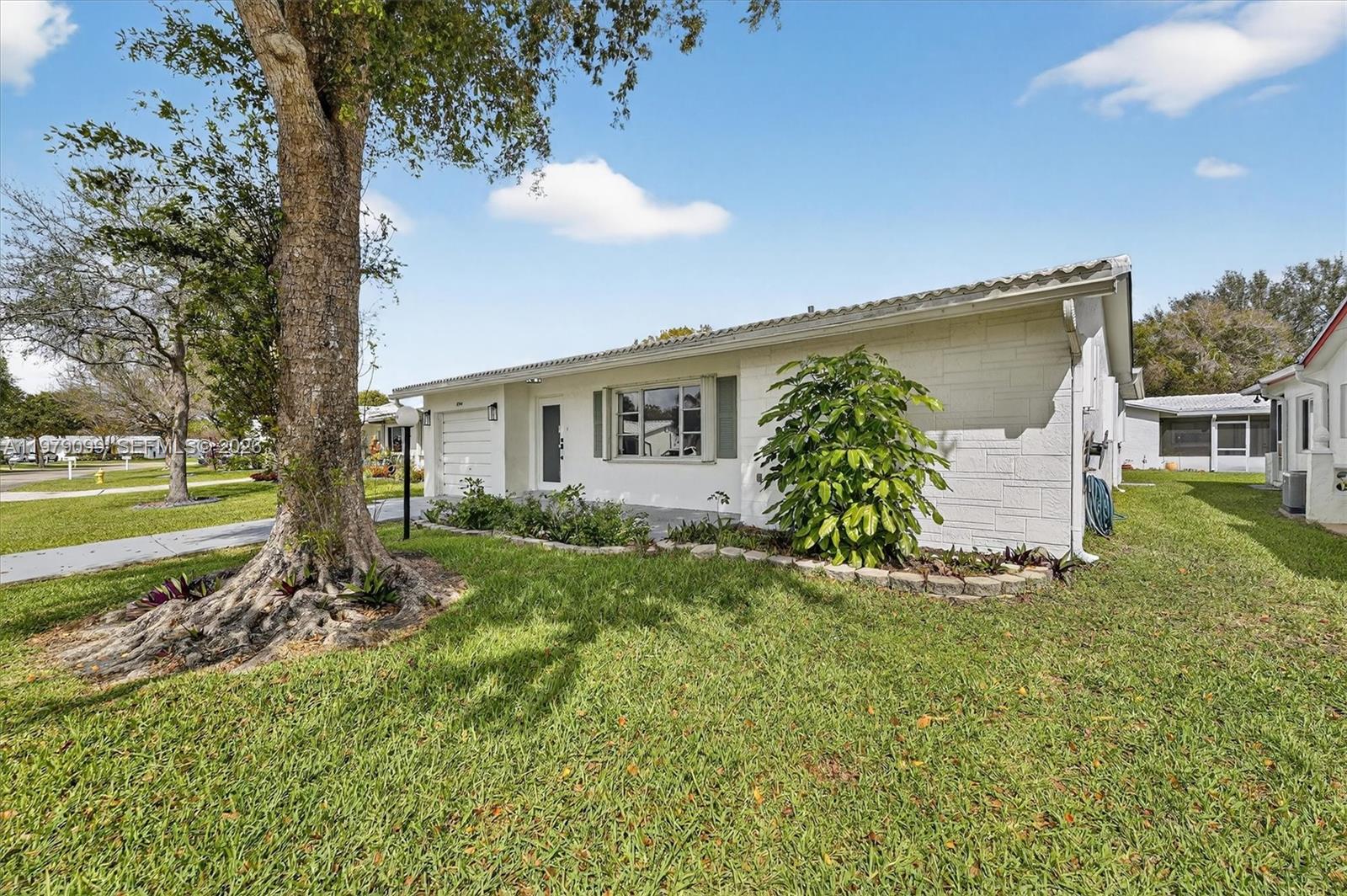 8941 Northwest 13th Street Plantation, FL 33322 - Photo 26 of 26 a view of a house with backyard and garden