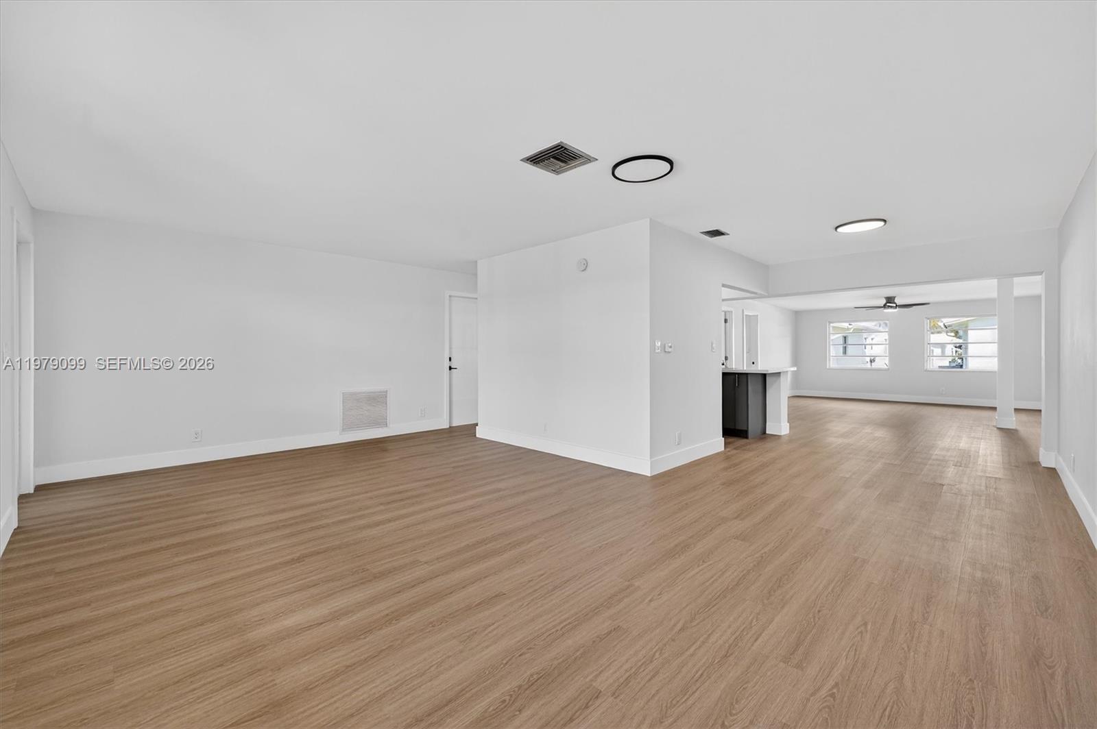8941 Northwest 13th Street Plantation, FL 33322 - Photo 3 of 26 a view of empty room with wooden floor
