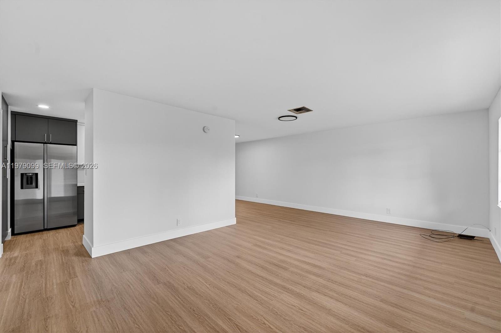 8941 Northwest 13th Street Plantation, FL 33322 - Photo 8 of 26 a view of an empty room with wooden floor
