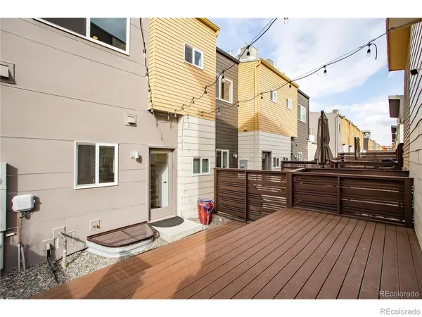 a view of outdoor space with wooden floor and seating