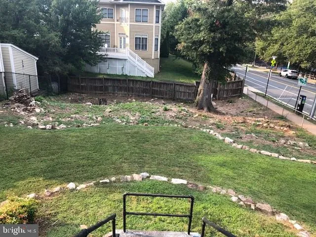 a view of a backyard with sitting area