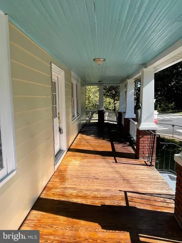 a view of swimming pool with seating space
