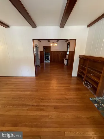 a view of room with furniture and a ceiling fan