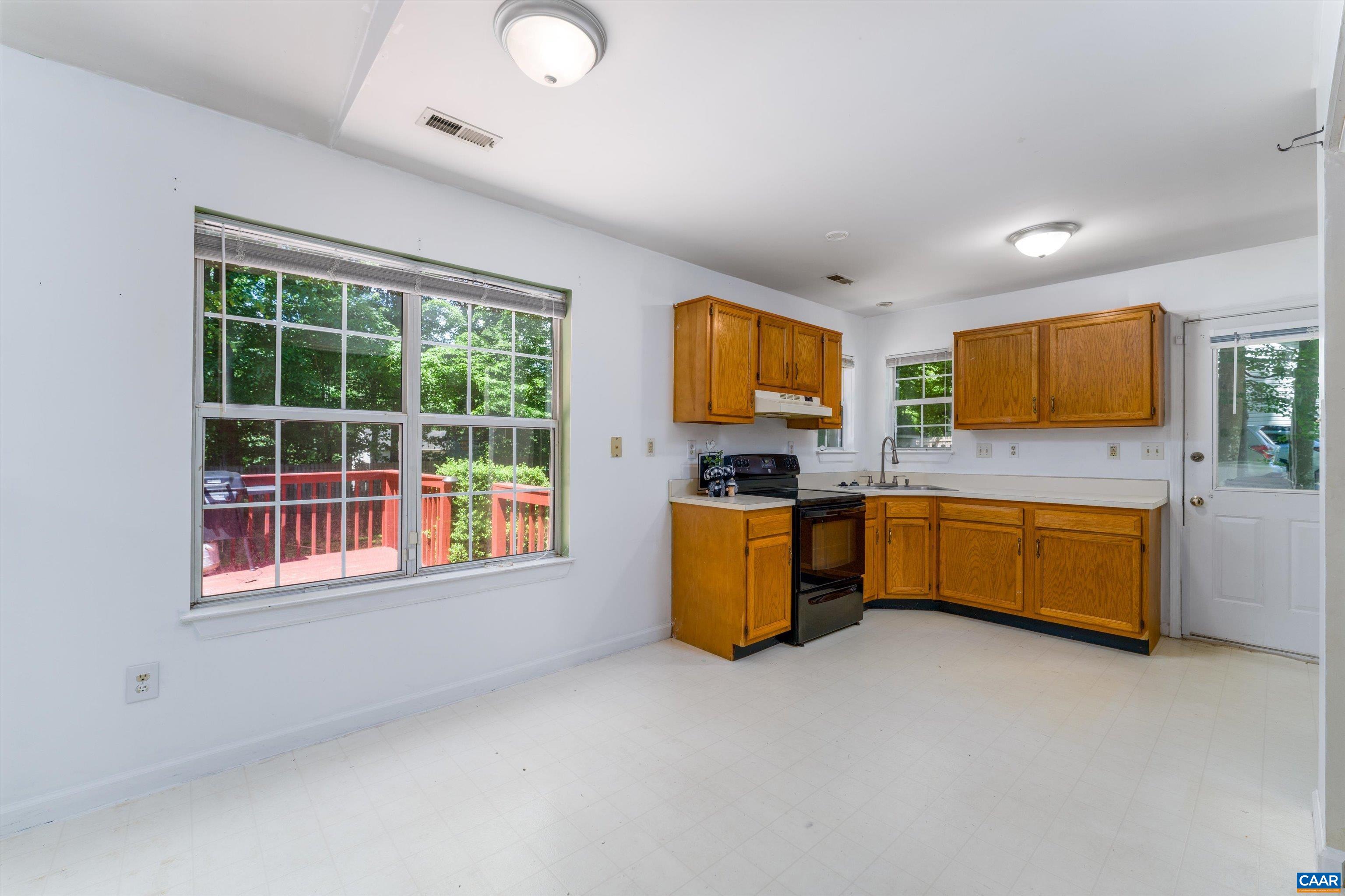 17 Riverside Drive Palmyra, VA 22963 - Photo 13 of 32 a kitchen with a stove a sink and a microwave