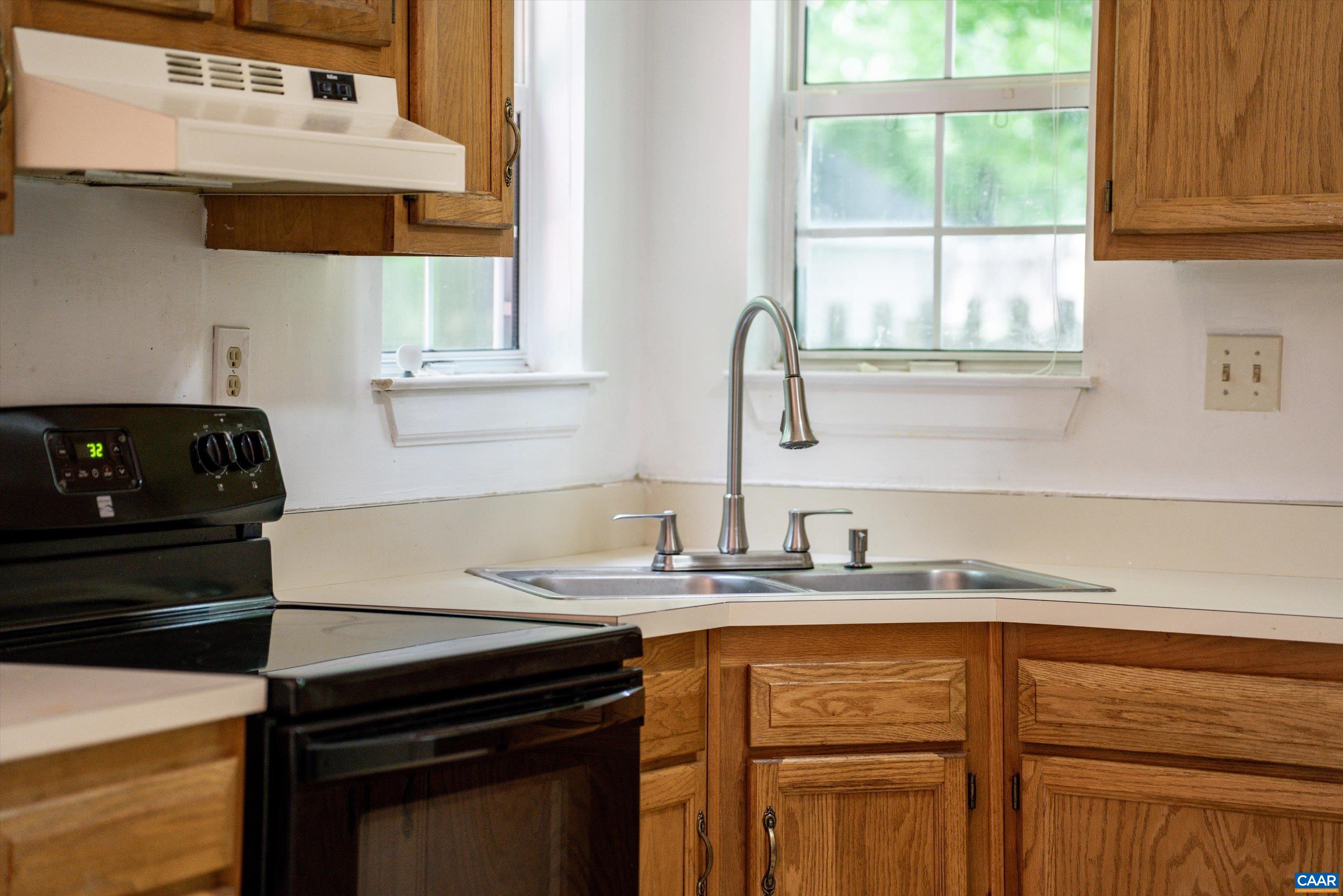 17 Riverside Drive Palmyra, VA 22963 - Photo 16 of 32 a kitchen with granite countertop a sink stove and cabinets