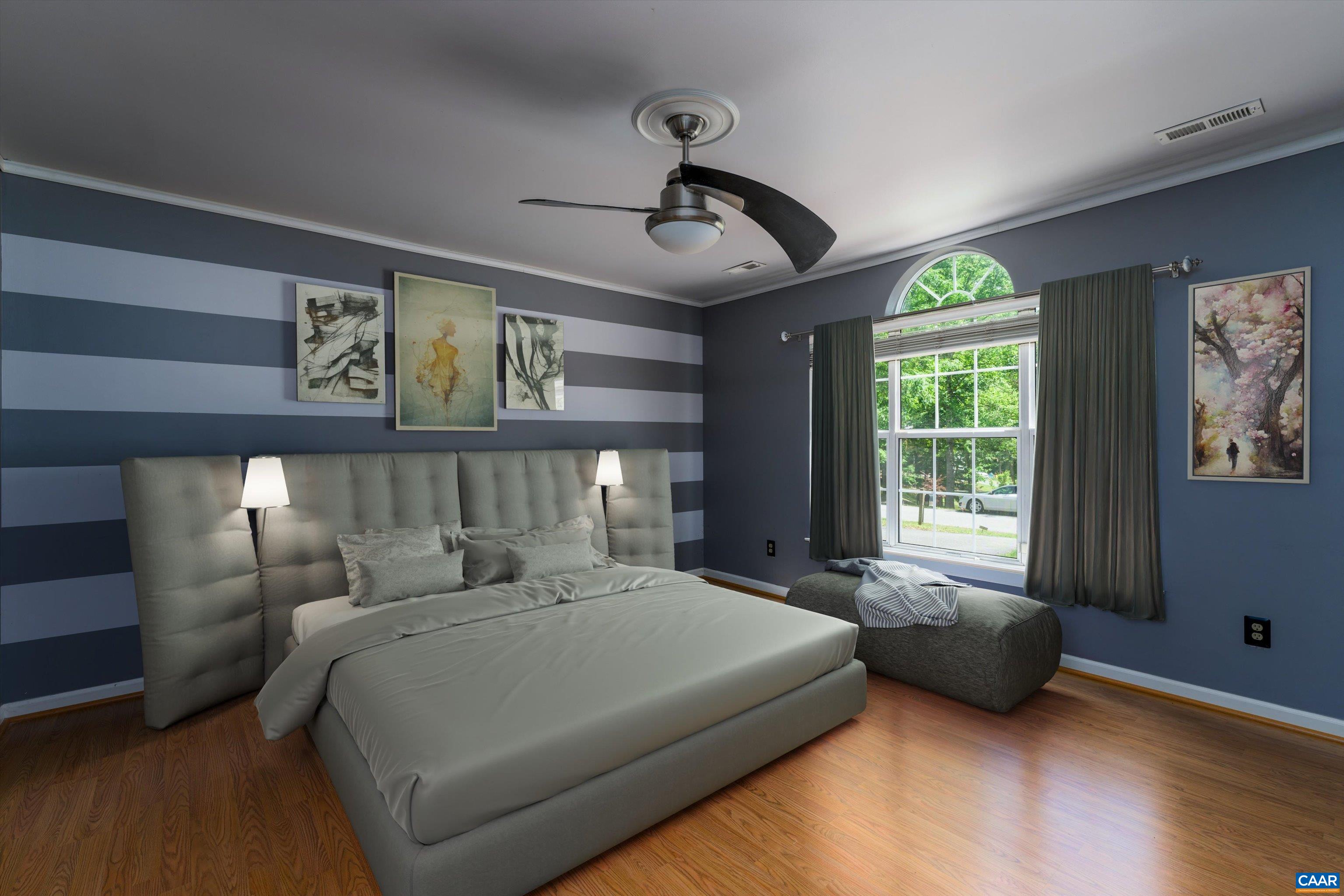 17 Riverside Drive Palmyra, VA 22963 - Photo 19 of 32 a bedroom with a bed a mirror and a large window