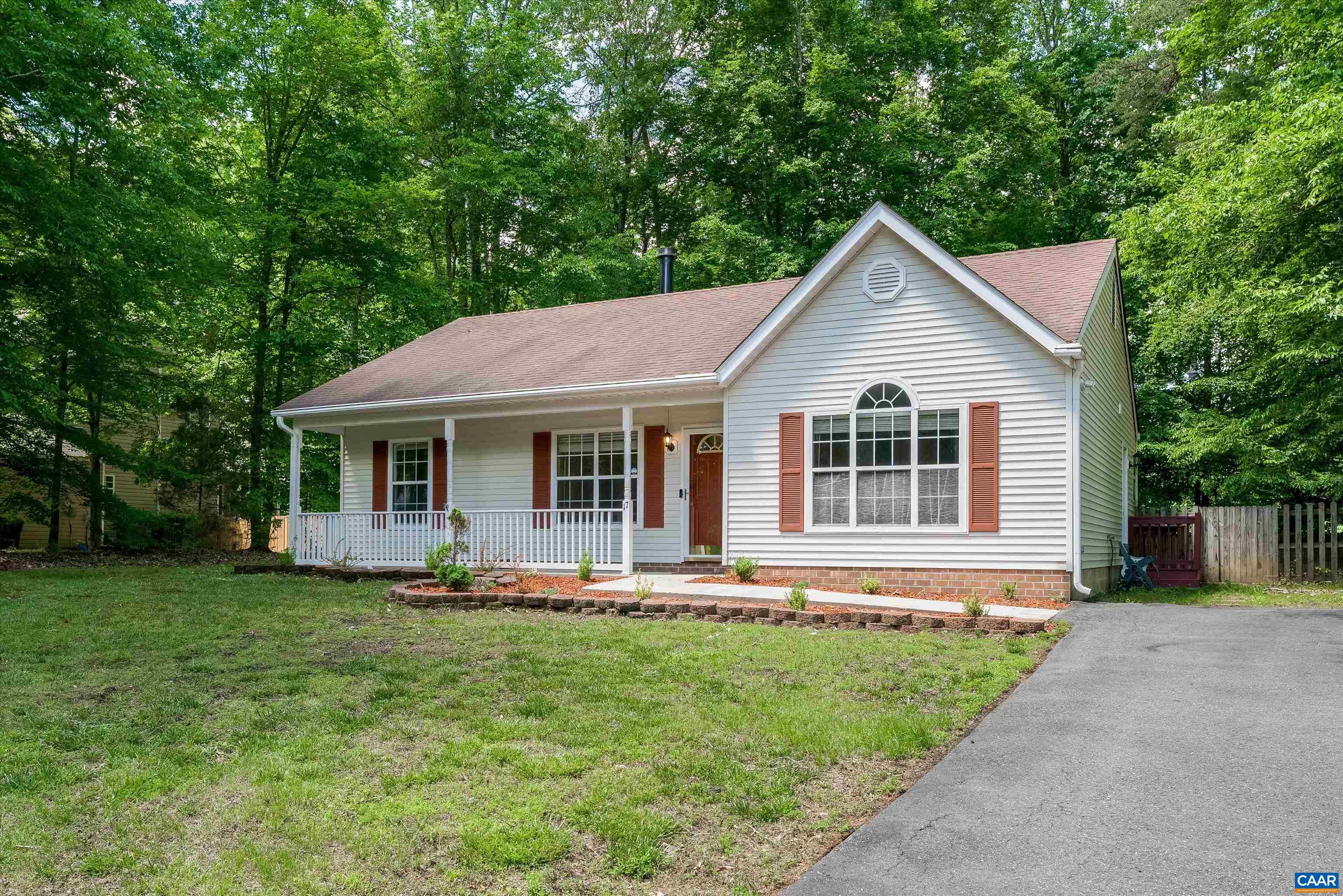 17 Riverside Drive Palmyra, VA 22963 - Photo 2 of 32 a front view of a house with a yard table and chairs