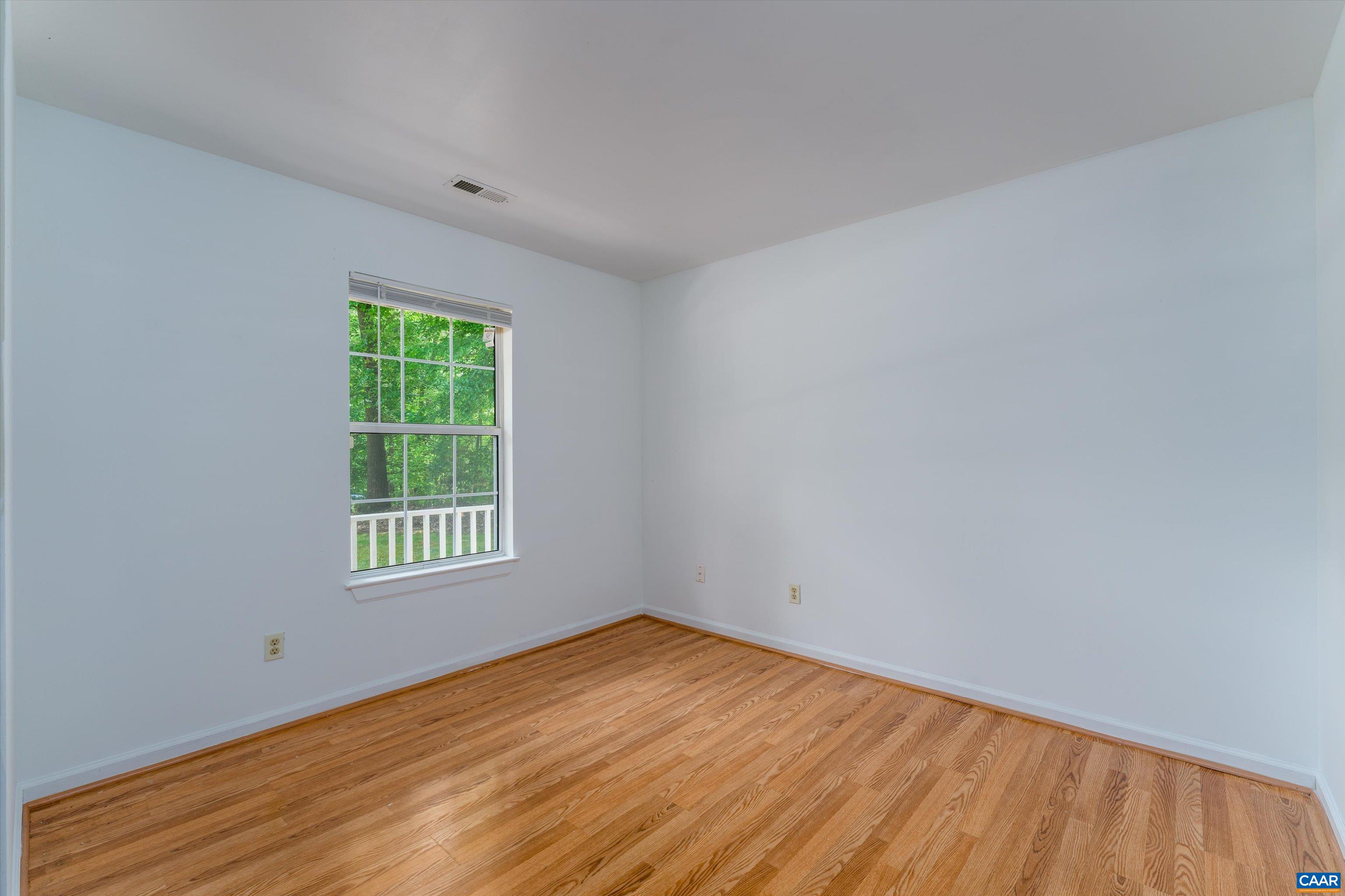 17 Riverside Drive Palmyra, VA 22963 - Photo 24 of 32 an empty room with wooden floor and windows
