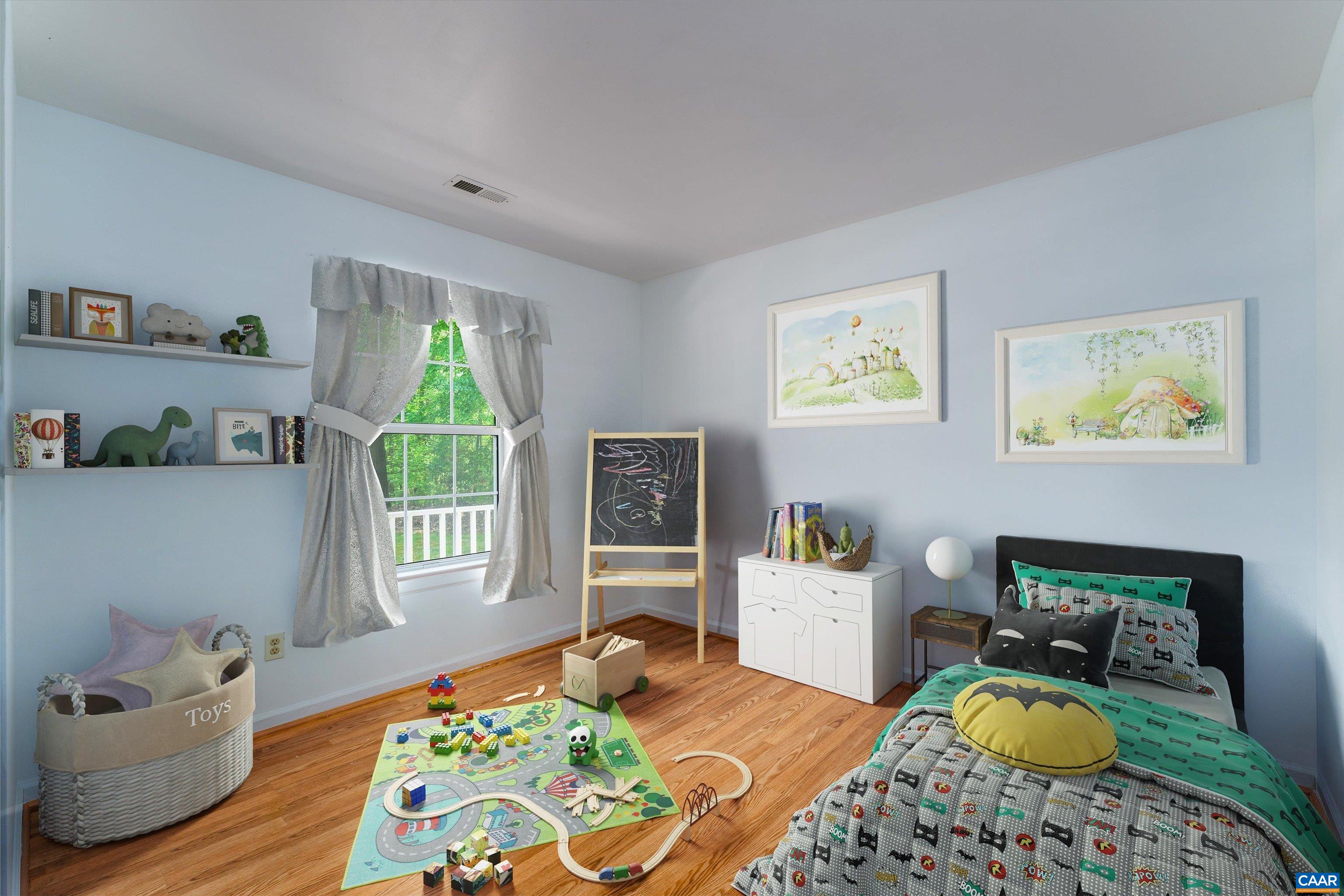 17 Riverside Drive Palmyra, VA 22963 - Photo 25 of 32 a bedroom with a bed and wooden floor