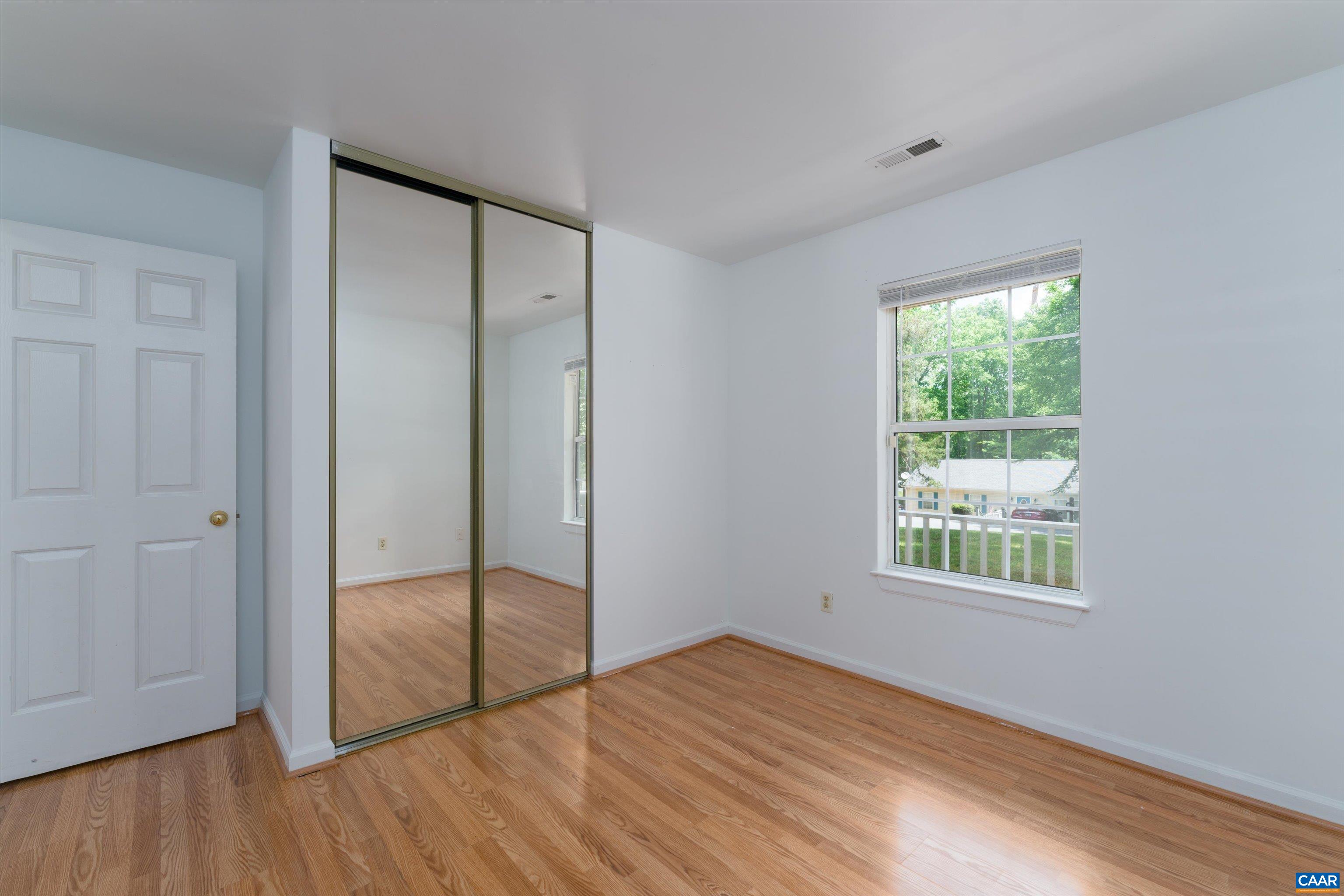 17 Riverside Drive Palmyra, VA 22963 - Photo 26 of 32 a view of an empty room with wooden floor and a window
