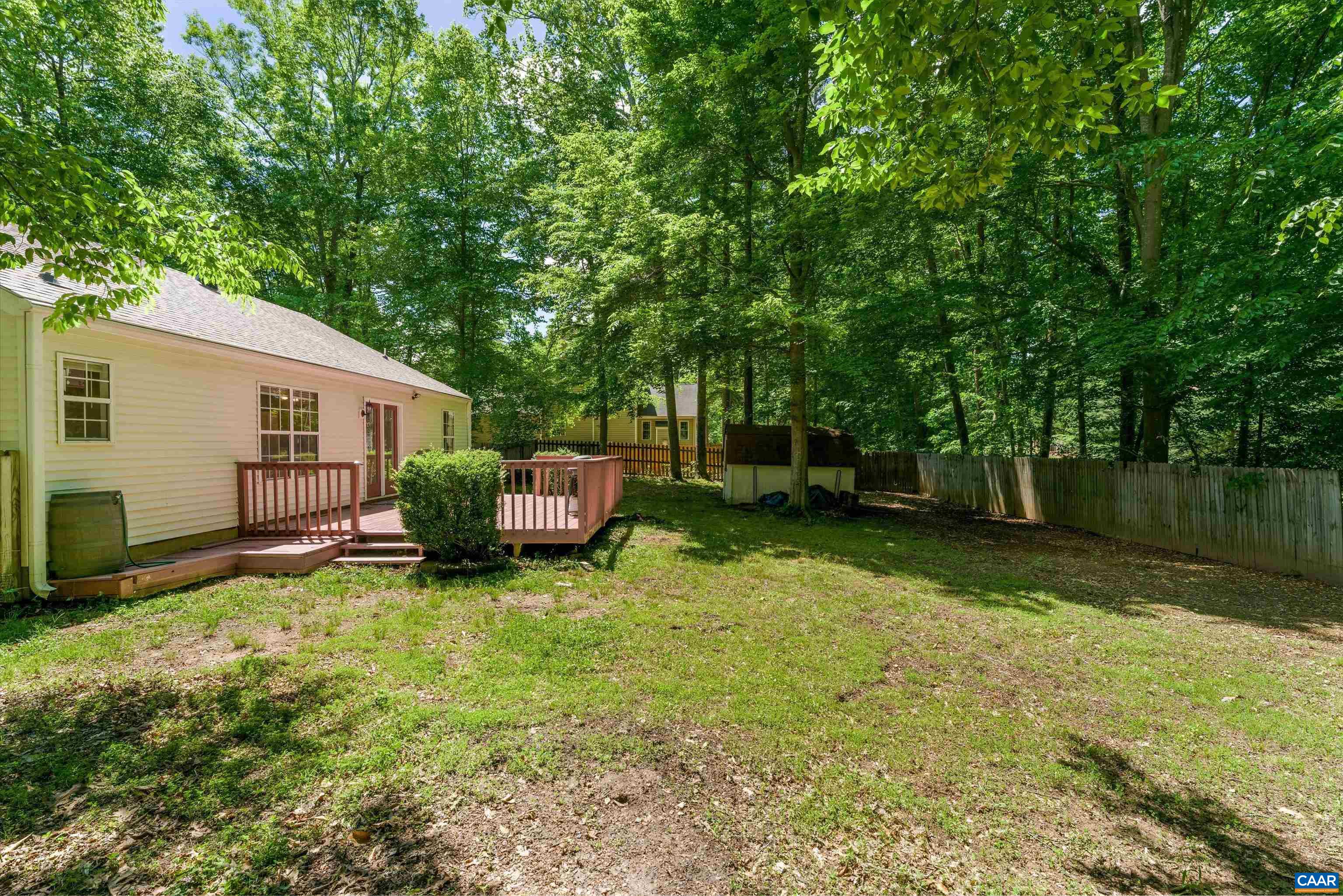 17 Riverside Drive Palmyra, VA 22963 - Photo 3 of 32 a backyard of a house with table and chairs