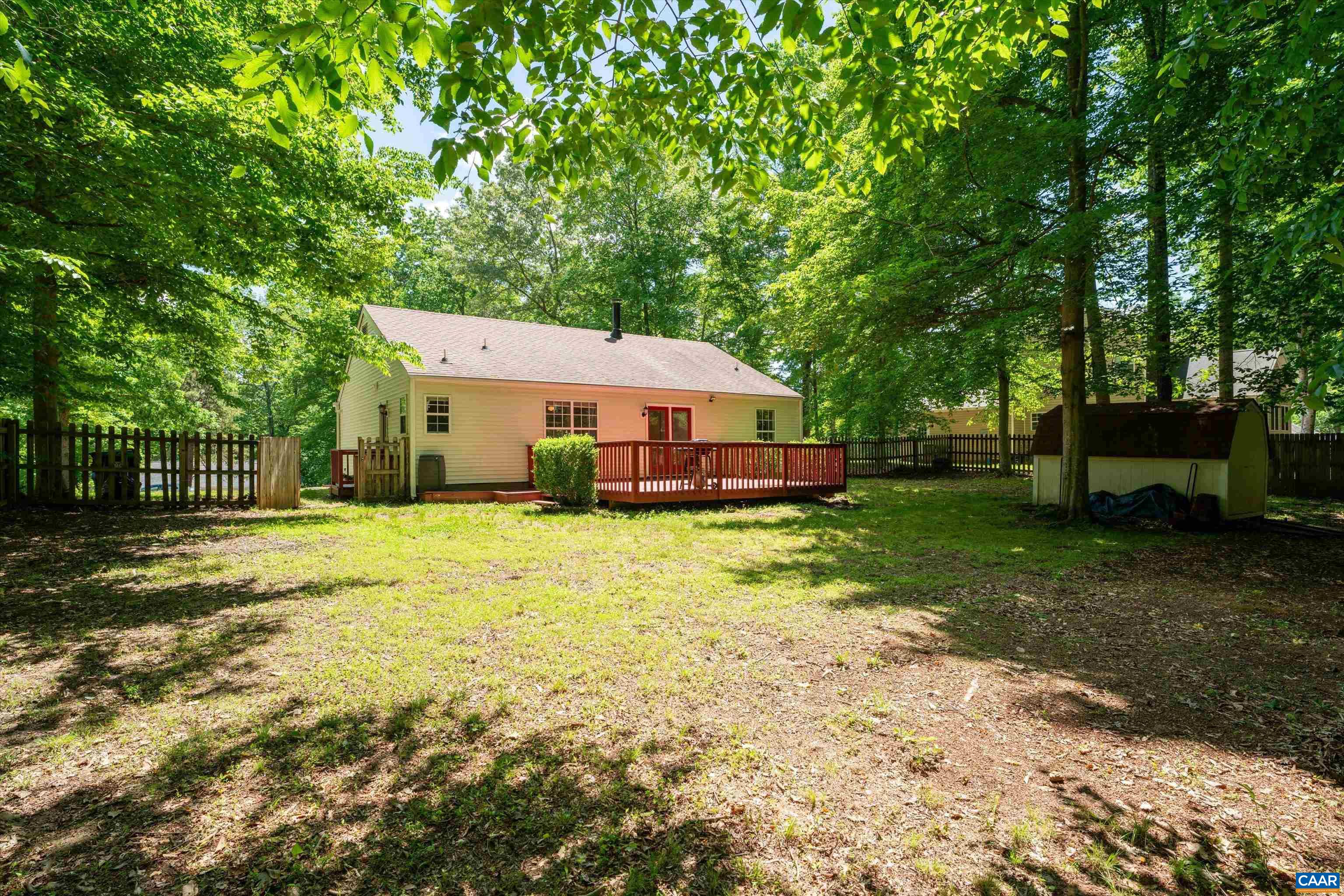 17 Riverside Drive Palmyra, VA 22963 - Photo 31 of 32 a front view of a house with a yard table and chairs