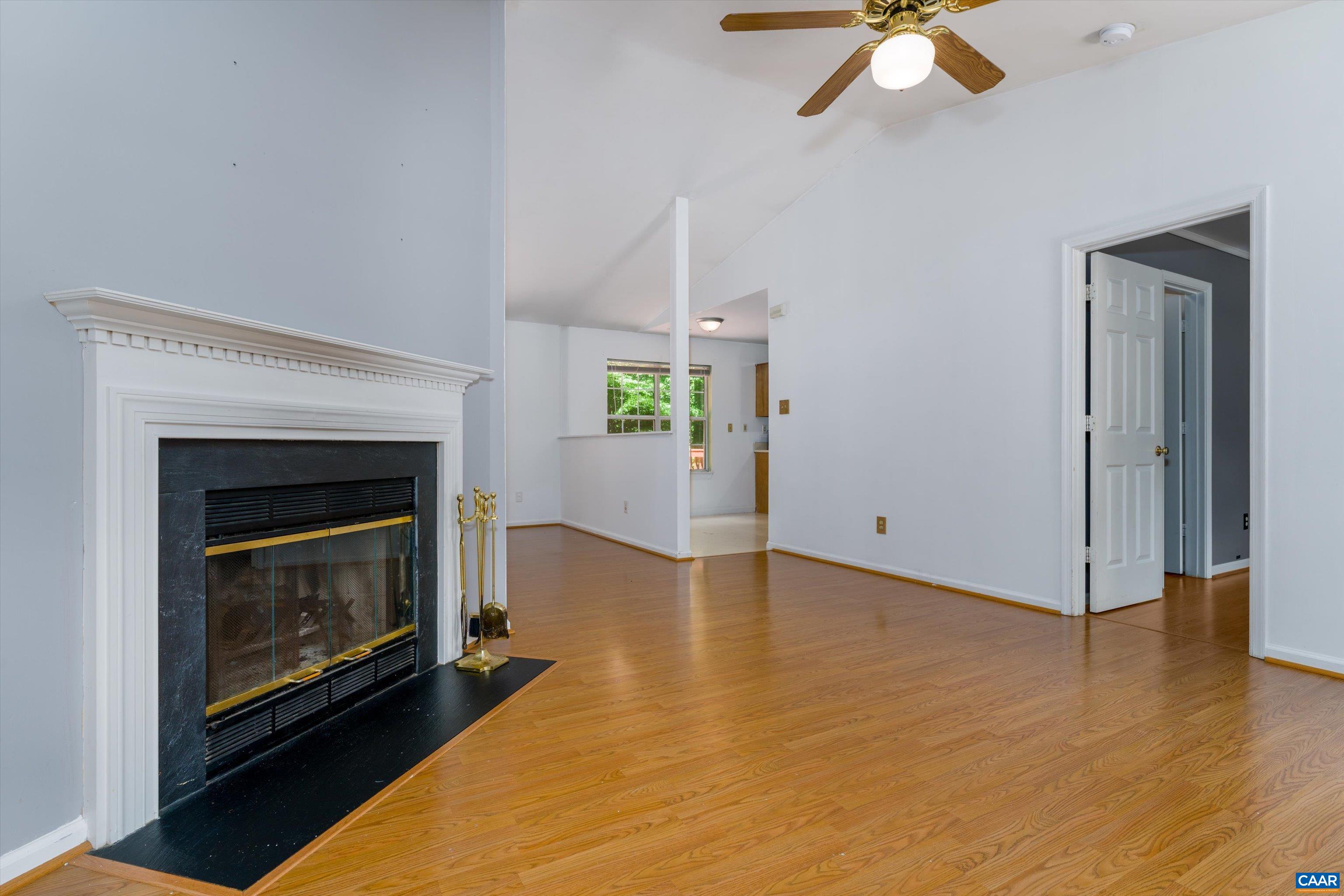 17 Riverside Drive Palmyra, VA 22963 - Photo 8 of 32 a view of an empty room with a fireplace and window
