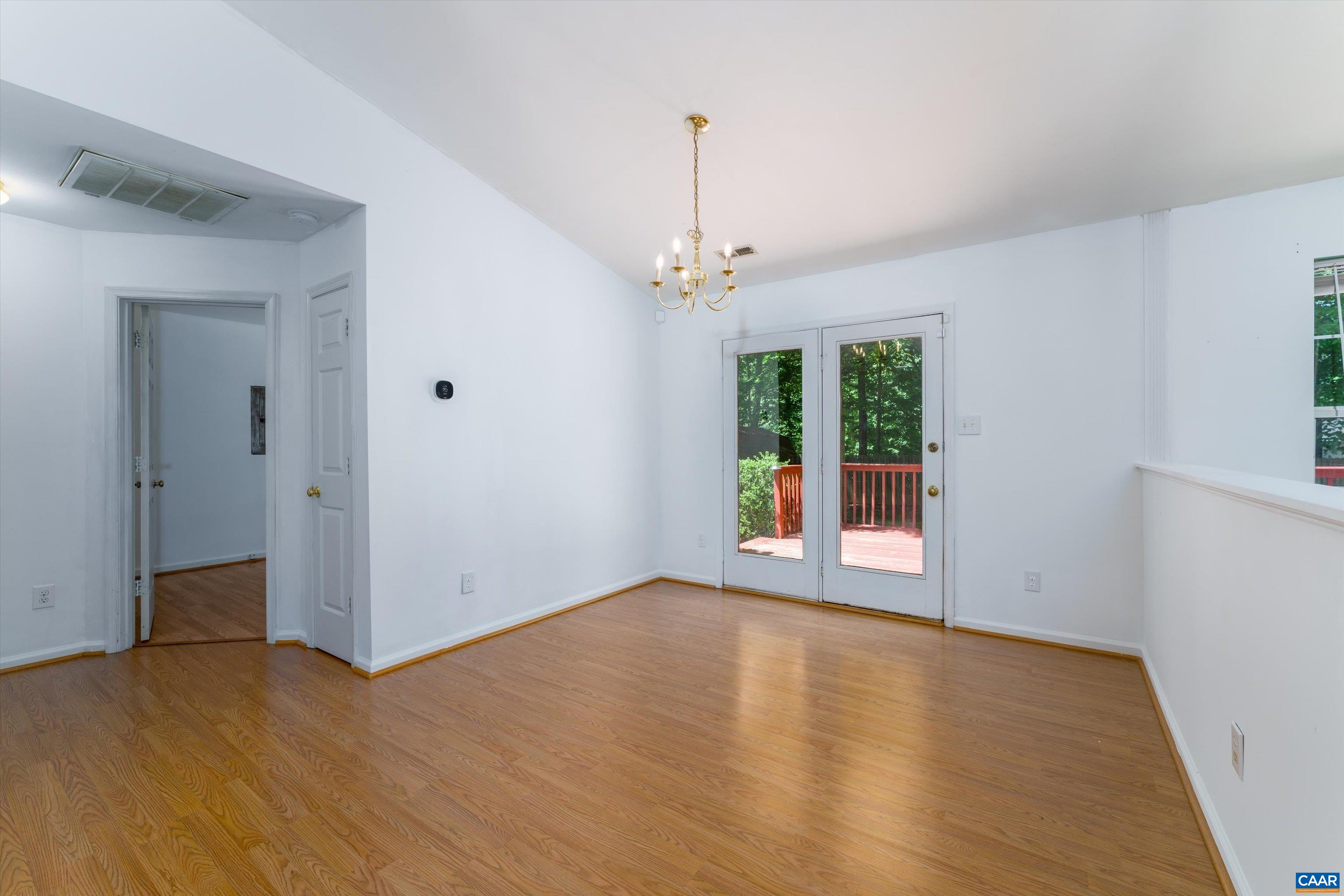 17 Riverside Drive Palmyra, VA 22963 - Photo 9 of 32 wooden floor in an empty room with a window