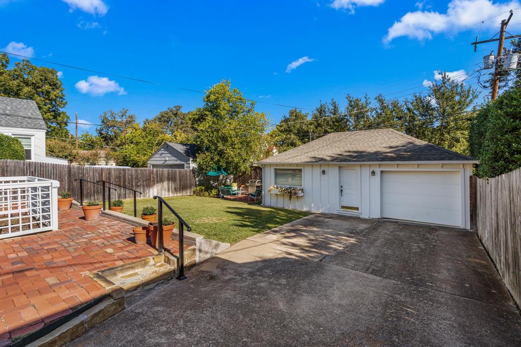 3628 Potomac Avenue Fort Worth, TX 76107 - Photo 32 of 32 a view of a house with backyard and a tree