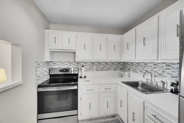 a dining room with furniture wooden floor and chandelier