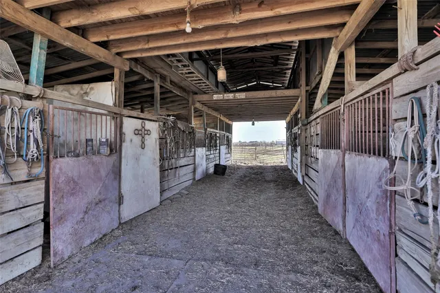 an aerial view of a golf course with a lake view