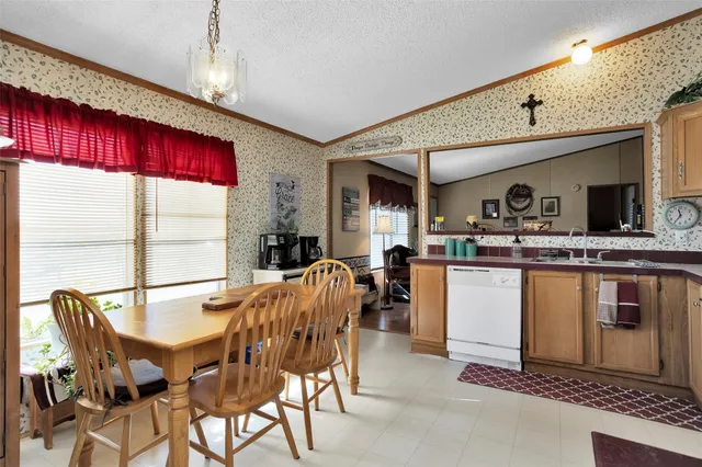 a living room with furniture ceiling fan and a rug