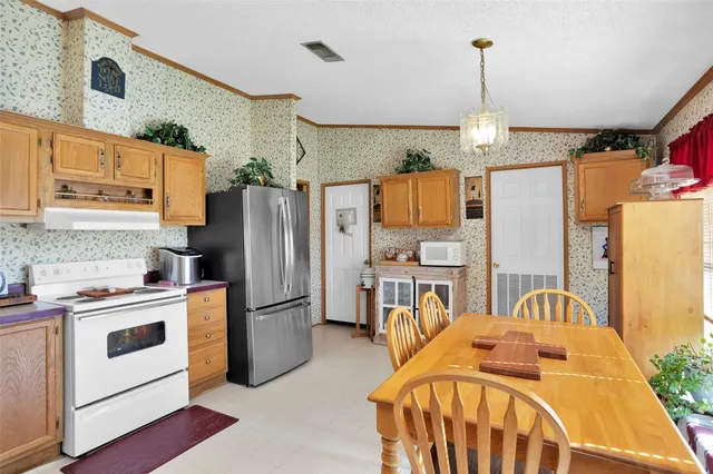 a bed room with a bed furniture and a flat tv screen