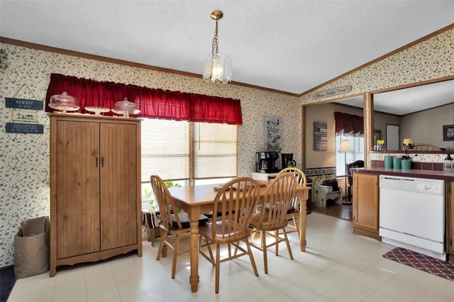 a view of a dining room with furniture