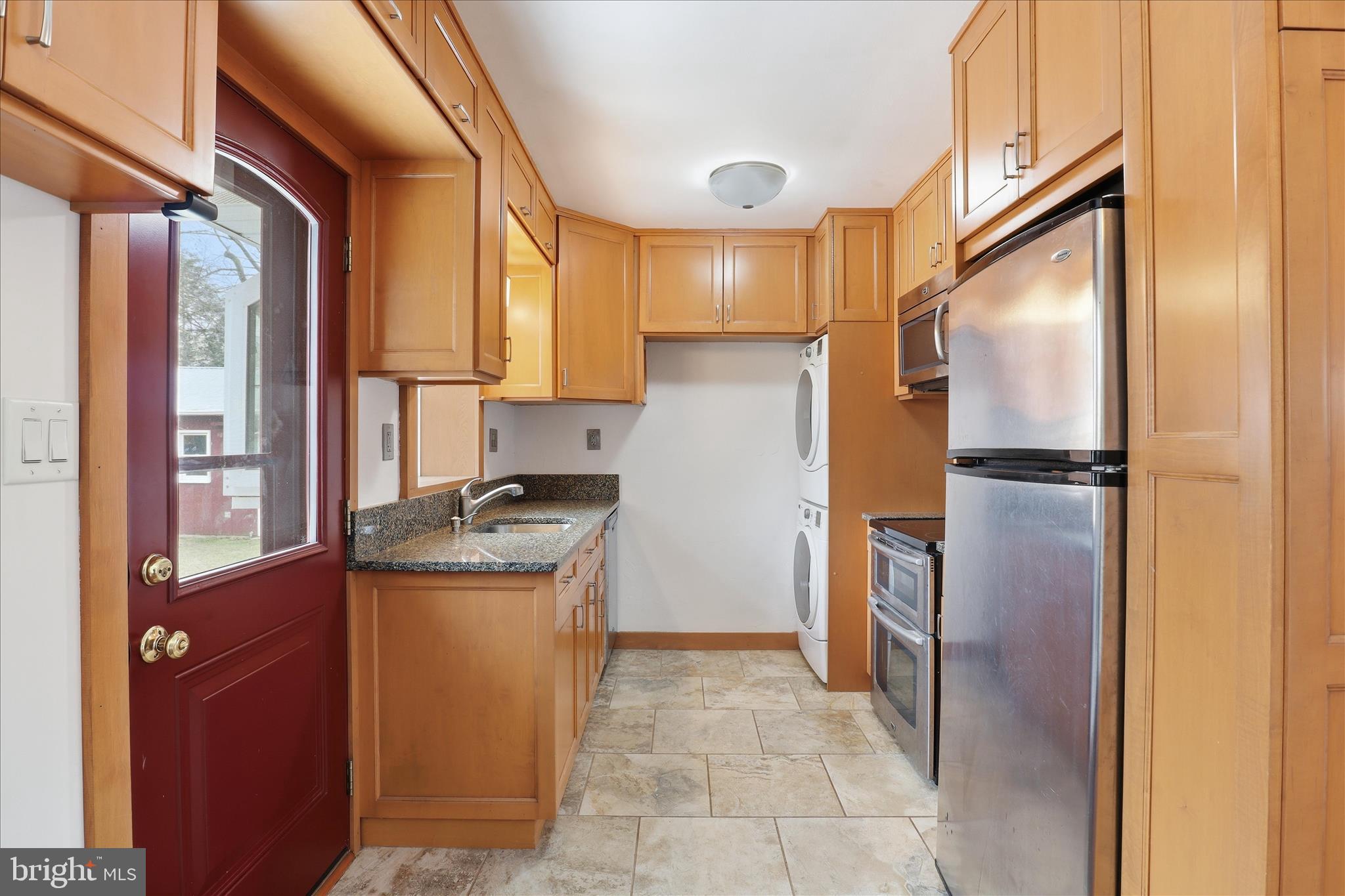 6003 Brookland Road Alexandria, VA 22310 - Photo 6 of 26 a kitchen with stainless steel appliances granite countertop a refrigerator and a stove