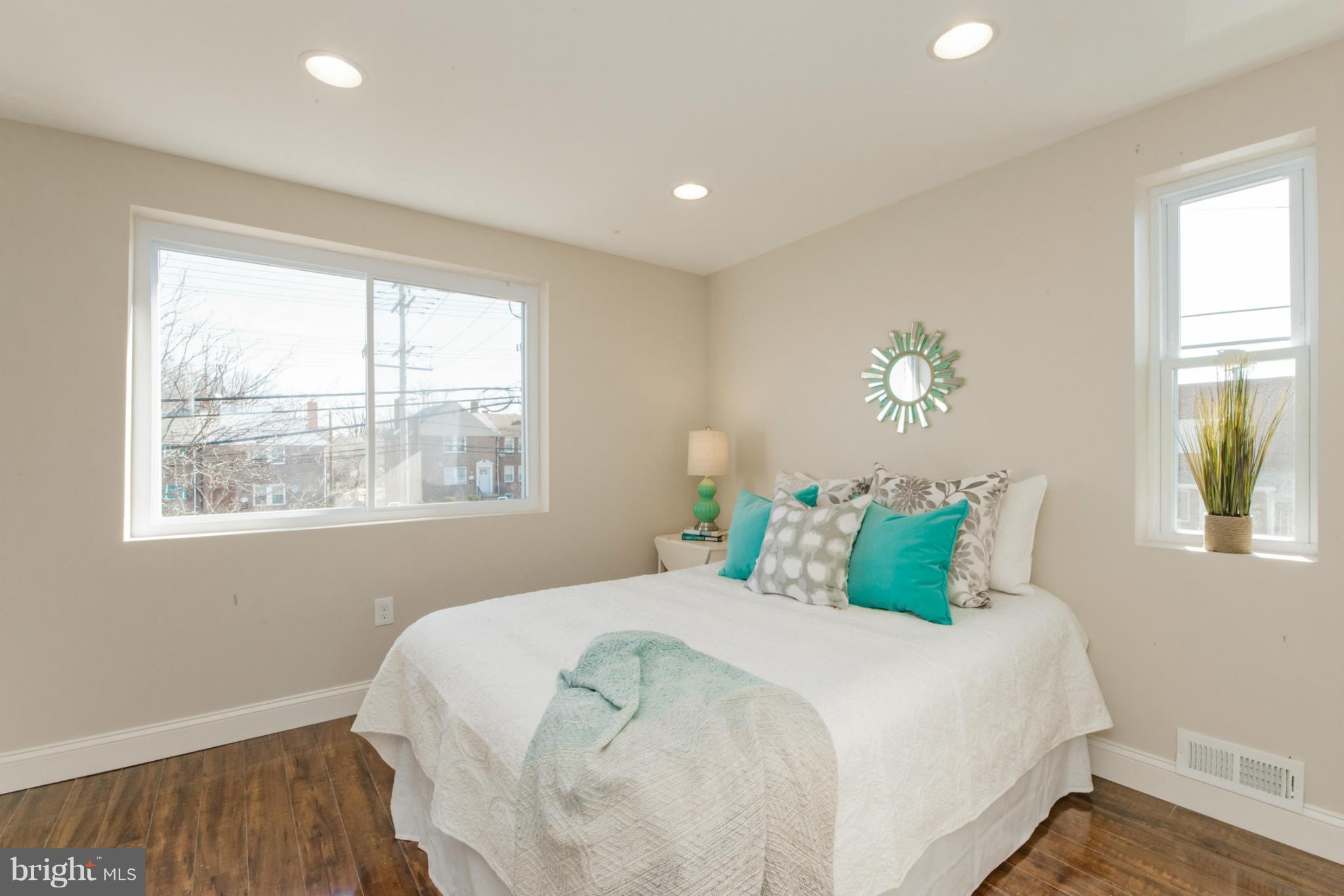 6922 Reisterstown Road Baltimore, MD 21215 - Photo 20 of 30 a bedroom with a bed and a window