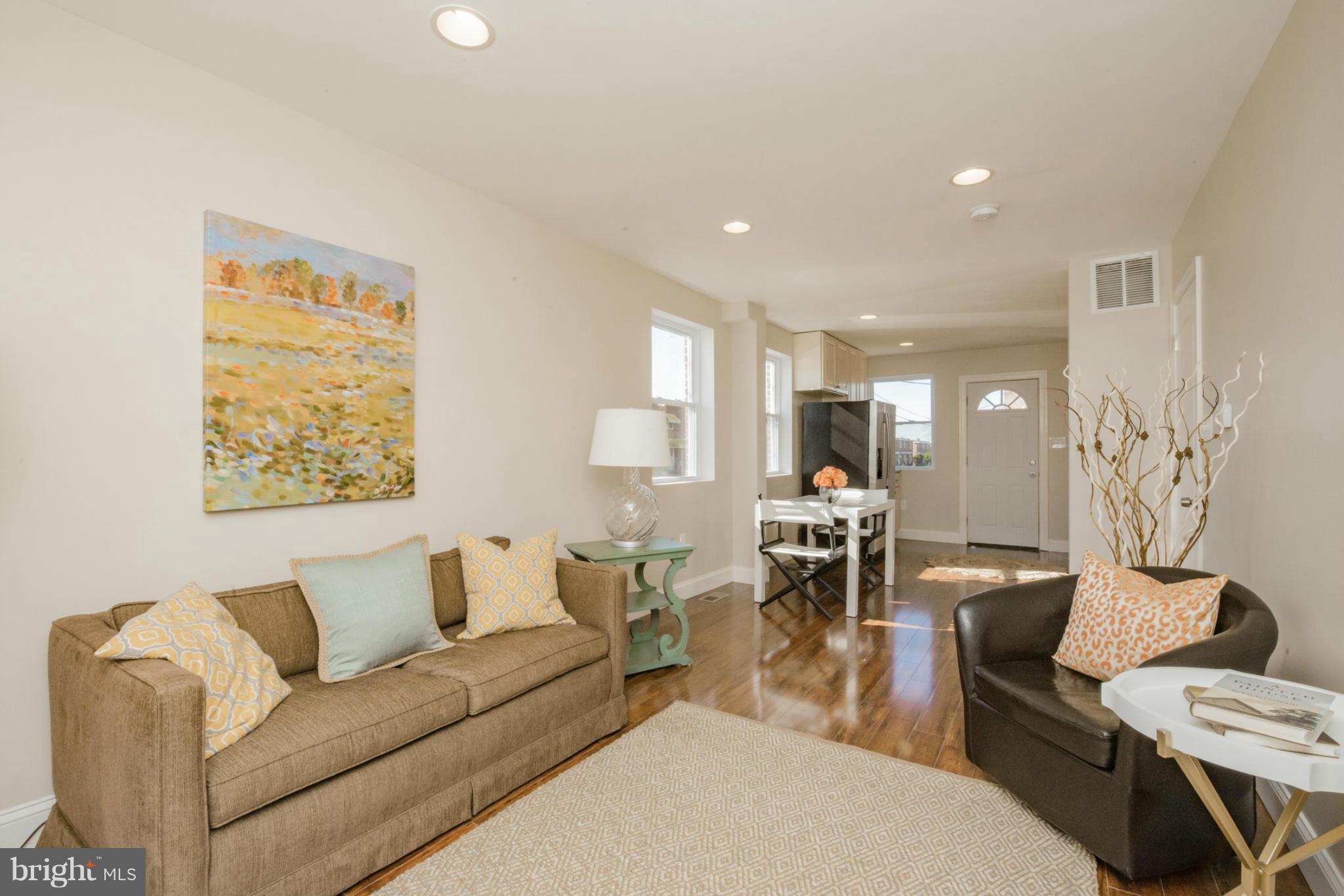 6922 Reisterstown Road Baltimore, MD 21215 - Photo 3 of 30 a living room with furniture and a table