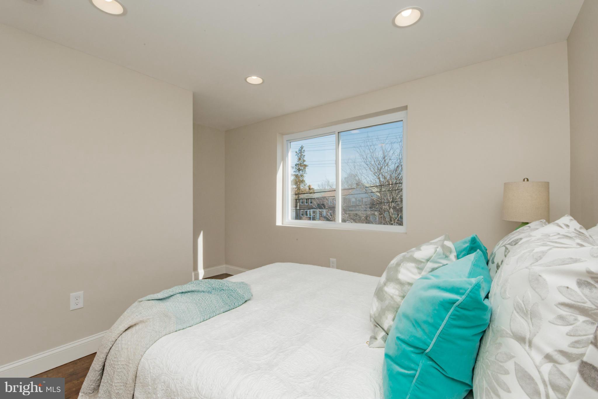 6922 Reisterstown Road Baltimore, MD 21215 - Photo 21 of 30 a bedroom with a bed and a window