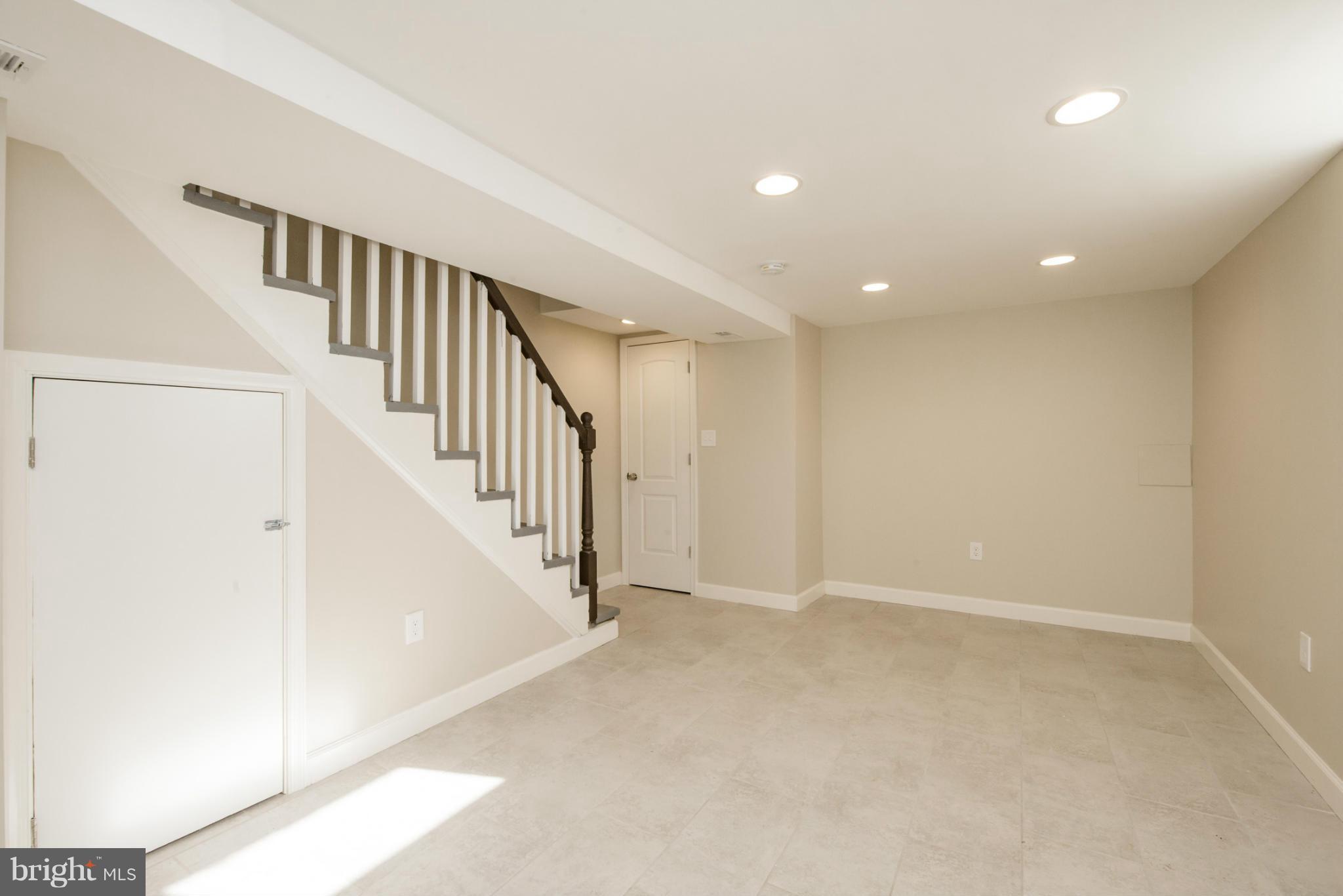 6922 Reisterstown Road Baltimore, MD 21215 - Photo 23 of 30 a view of an entryway with stairs