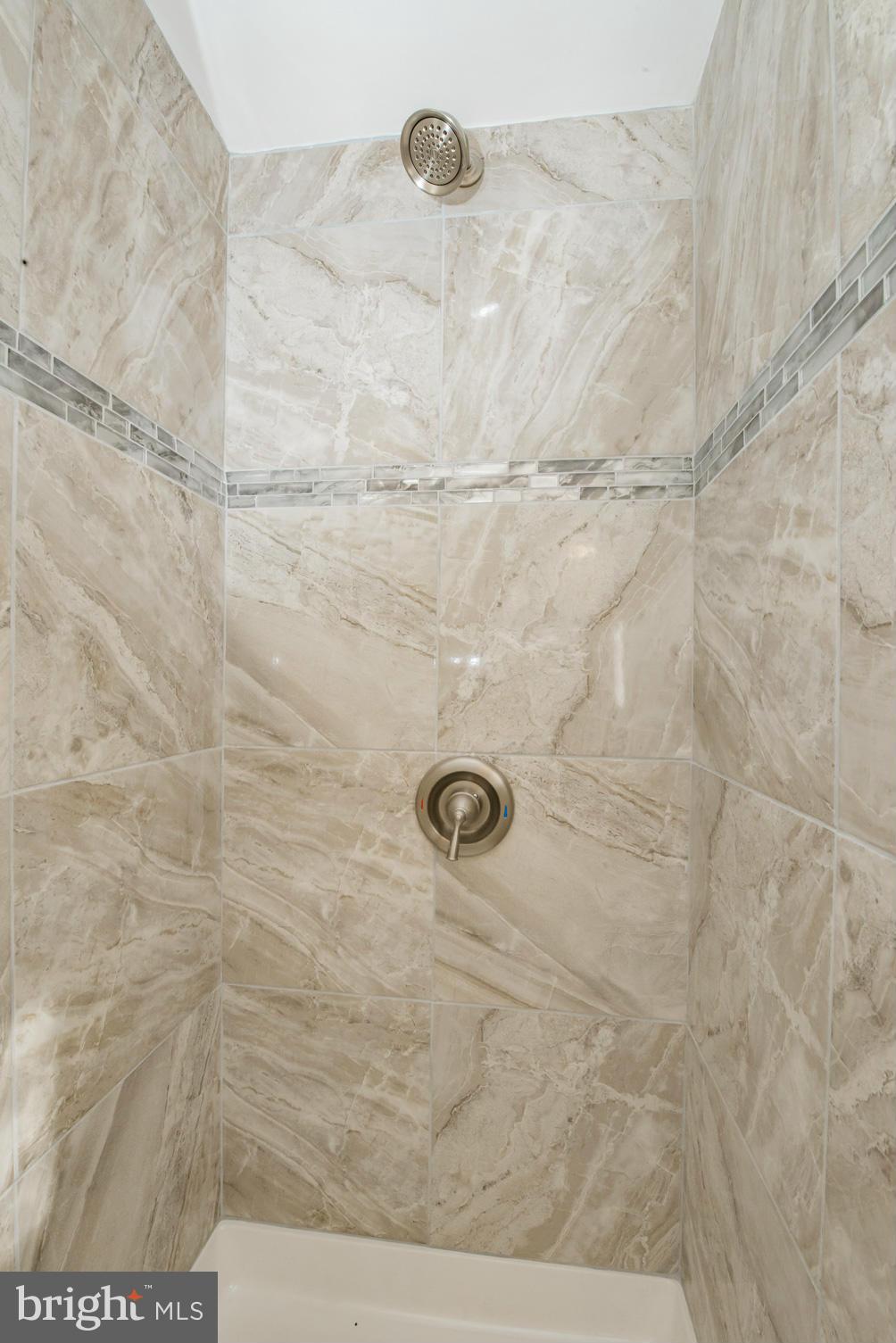 6922 Reisterstown Road Baltimore, MD 21215 - Photo 26 of 30 a bathroom with a shower