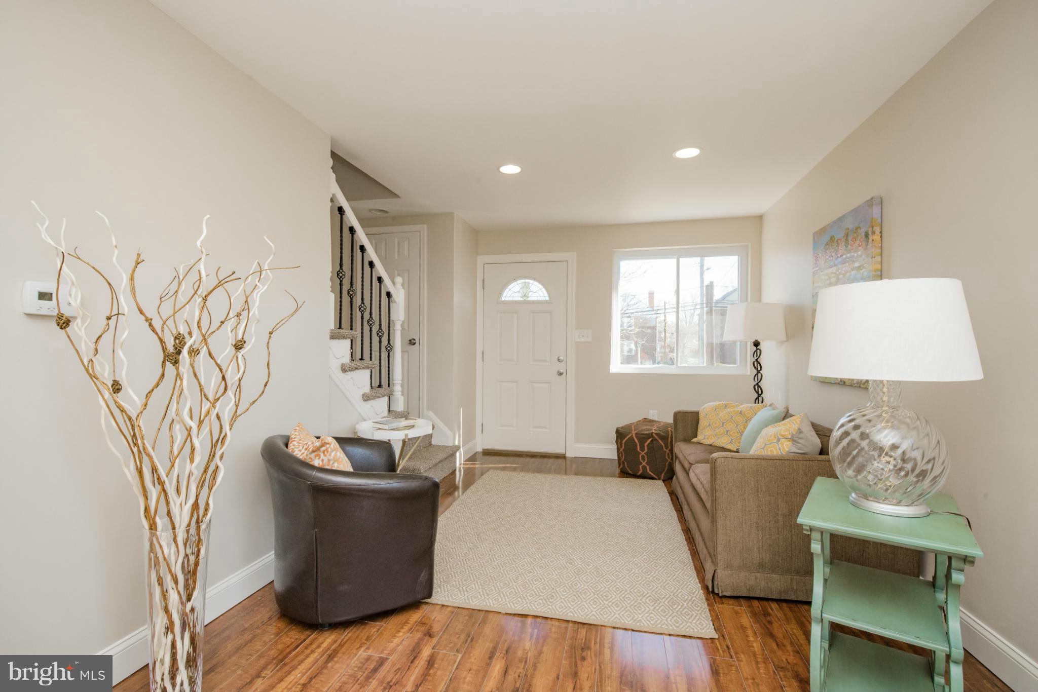 6922 Reisterstown Road Baltimore, MD 21215 - Photo 4 of 30 a living room with furniture and a window