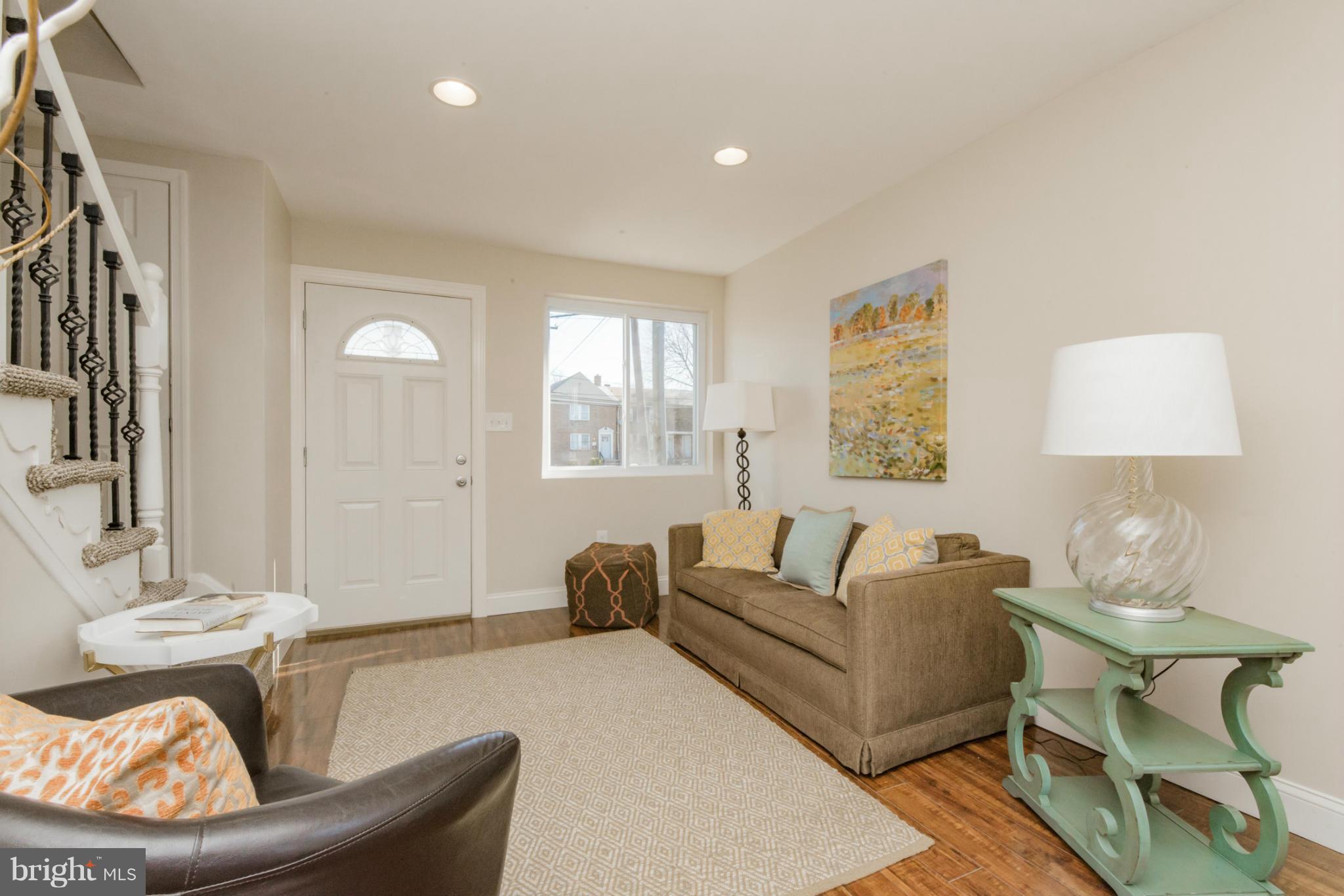 6922 Reisterstown Road Baltimore, MD 21215 - Photo 5 of 30 a living room with furniture and a lamp