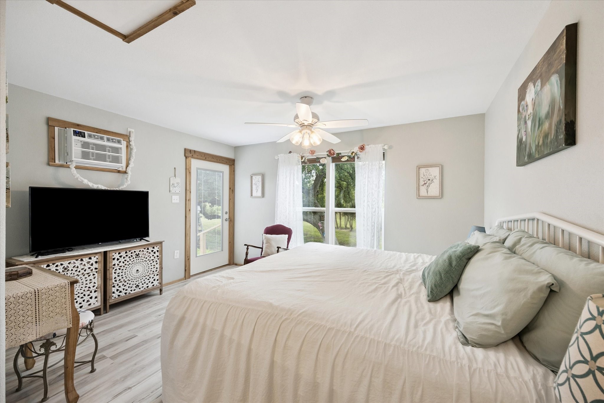 9015 Highway 36 Brenham, TX 77833 - Photo 13 of 19 a bedroom with a bed and a flat screen tv