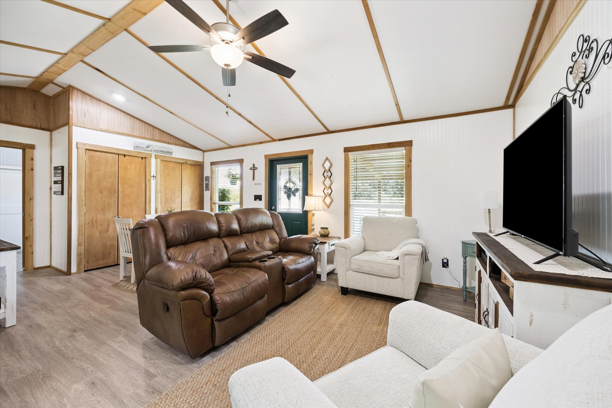 9015 Highway 36 Brenham, TX 77833 - Photo 6 of 19 a living room with furniture a flat screen tv and a window